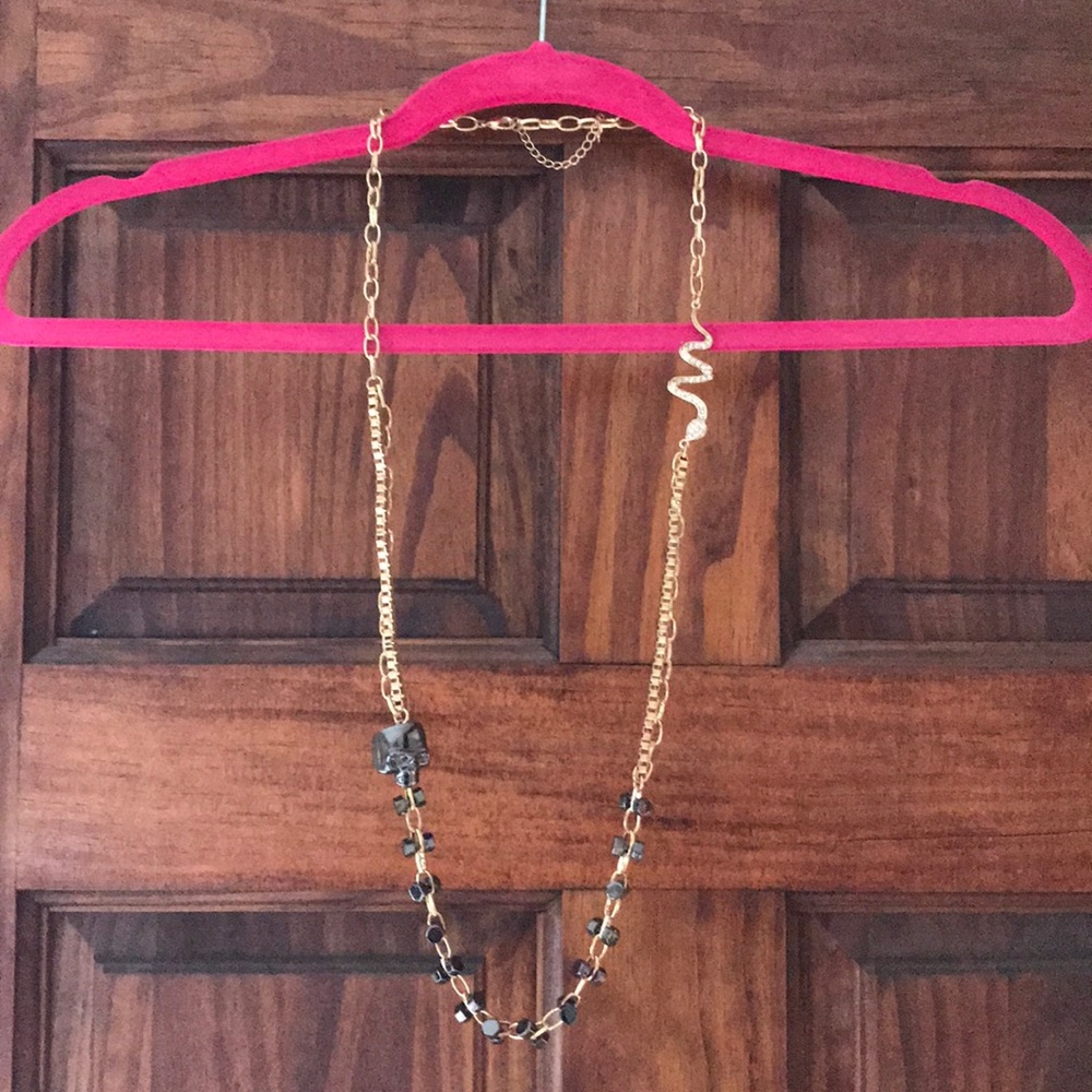 Torrid long gold-time skull/snake necklace